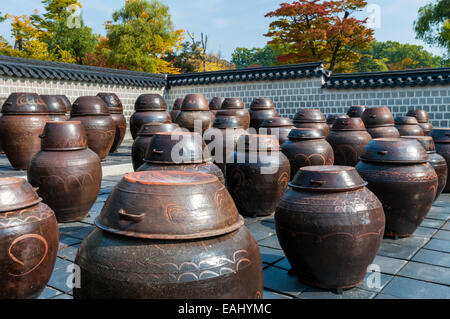 Dozens of large clay pots hold fermenting kimchi in Seoul, South Korea. Stock Photo