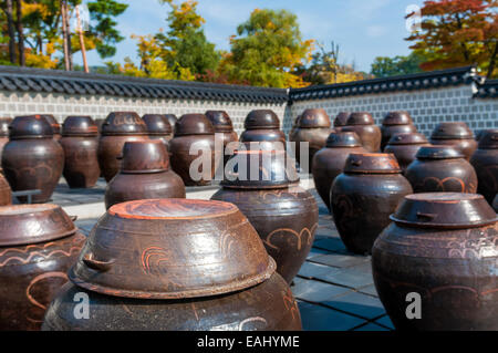 Dozens of large clay pots hold fermenting kimchi in Seoul, South Korea. Stock Photo