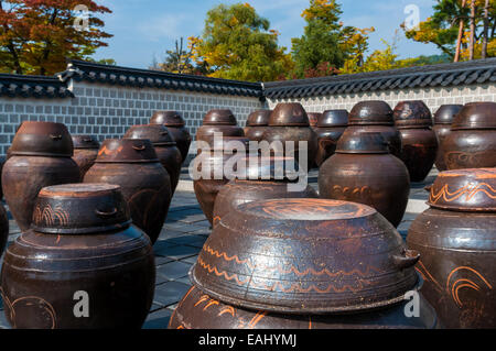 Dozens of large clay pots hold fermenting kimchi in Seoul, South Korea. Stock Photo