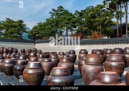 Dozens of large clay pots hold fermenting kimchi in Seoul, South Korea. Stock Photo