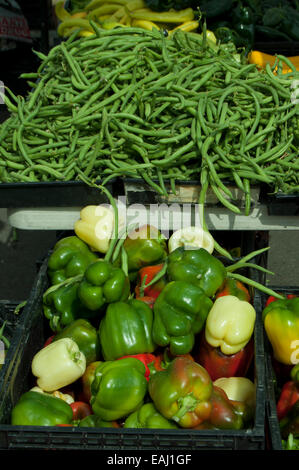 String beans and peppers on display for sale at a Farmers Market. Stock Photo