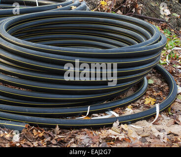 scroll of plastic sewer pipe outside closeup Stock Photo