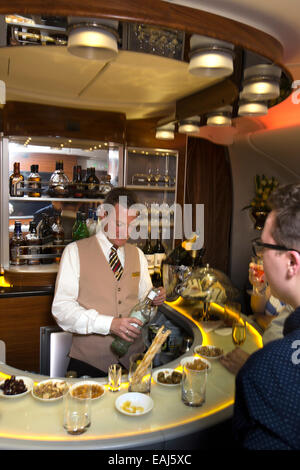 Emirates Airline, passenger in bar of A380 Business Class cabin Stock Photo