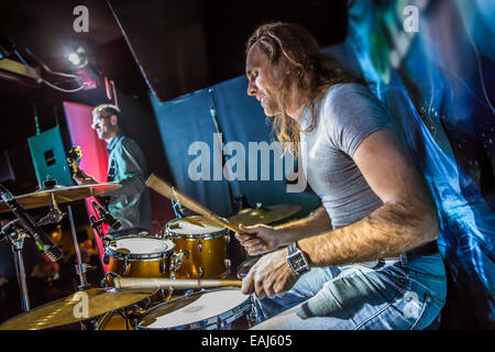 Drummer playing on drum set on stage. Stock Photo