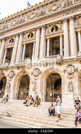 people relaxing on the stairs of the parisian opera, opéra garnier, paris, ile de france, france Stock Photo