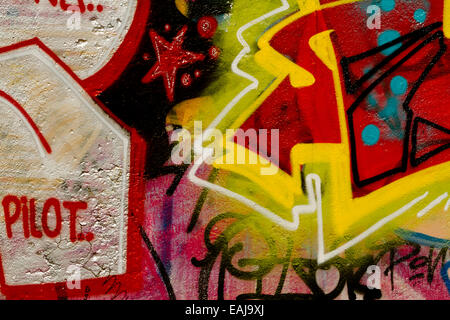 Graffiti art urban Berlin Wall pilot Tag arrow Stock Photo