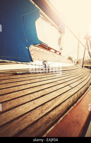 Vintage filtered close up picture of yacht deck and rigging. Stock Photo