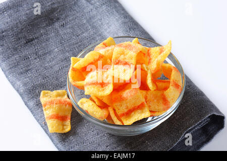 Bowl of bacon-flavored puffed wheat chips Stock Photo