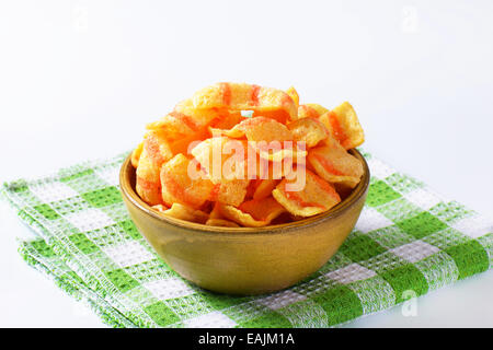 Bowl of bacon-flavored puffed wheat chips Stock Photo