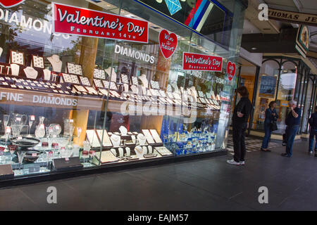 Woman looking at jewelery window display with Valentine's day specials Stock Photo