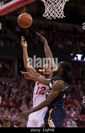 Wisconsin guard Traevon Jackson shoots between Michigan's Nik Stauskas ...