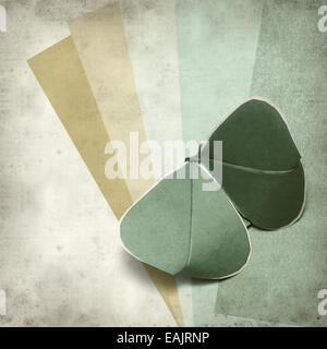 textured old paper background with kirigami butterfly Stock Photo