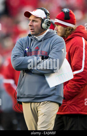 Nebraska head coach Bo Pelini leads his players onto the field before ...