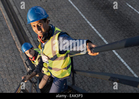 Workers standing on staircase Stock Photo