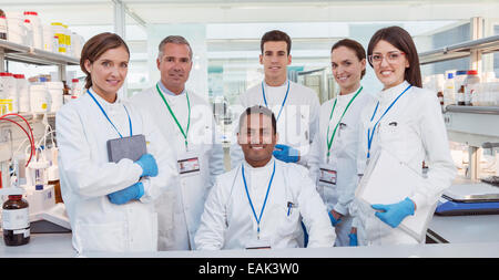 Scientists smiling in laboratory Stock Photo