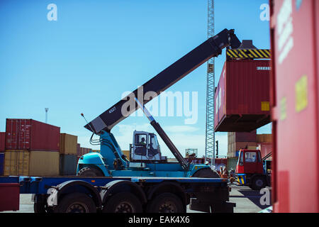 Crane lifting cargo container Stock Photo