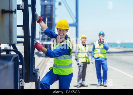 Worker climbing cargo crane Stock Photo