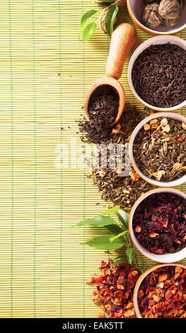 Dry tea in bowls shot from upper view Stock Photo