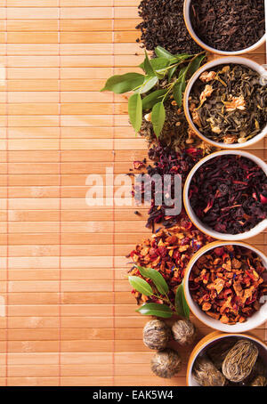Dry tea in bowls shot from upper view Stock Photo