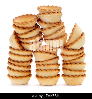 a pile of empty tartlets on a white background Stock Photo