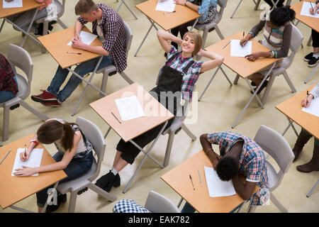 Students writing their GCSE exam in classroom Stock Photo