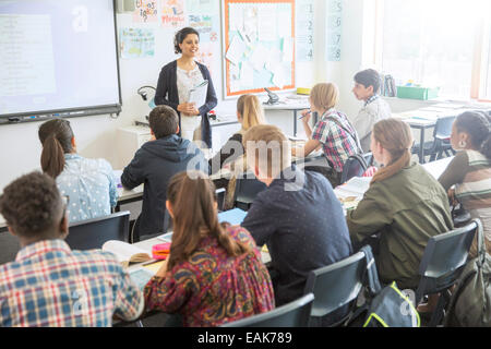 Teacher and students in classroom during lesson Stock Photo