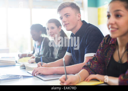 Students sitting in classroom during lesson Stock Photo