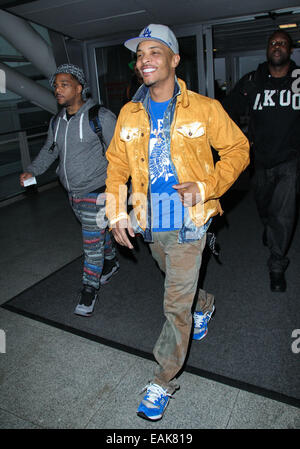 Rapper T.I. (real name Clifford Joseph Harris, Jr) arriving at John F. Kennedy (JFK) Airport  Featuring: T.I. Where: New York, New York, United States When: 15 May 2014 Stock Photo