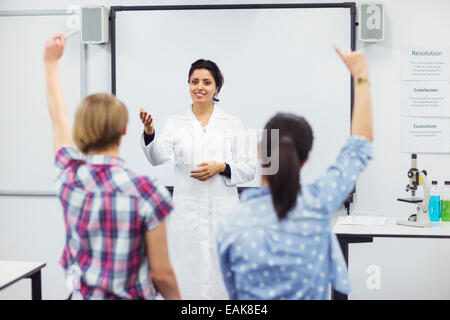 Students with their teacher in school lab Stock Photo