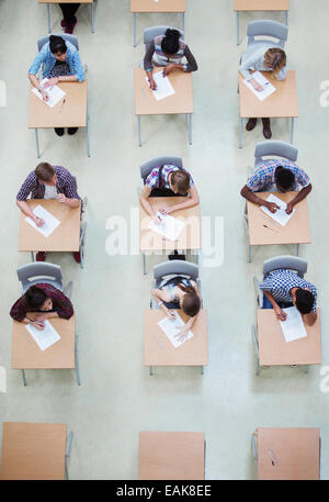 Overhead view of students writing their GCSE examination Stock Photo