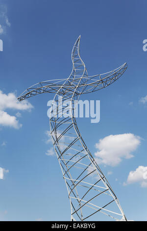 Dancing electricity pylon, Sculpture 'Zauberlehrling', German for 'Sorcerer’s Apprentice' created by Kuenstlergruppe Inges Stock Photo
