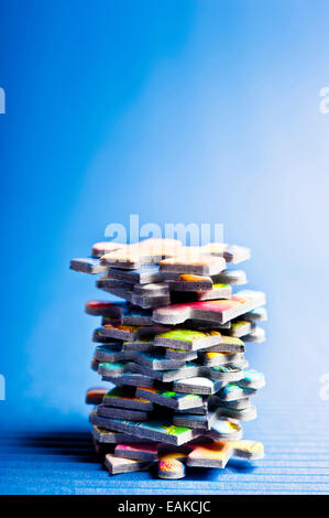 stack of jigsaw puzzle pieces Stock Photo