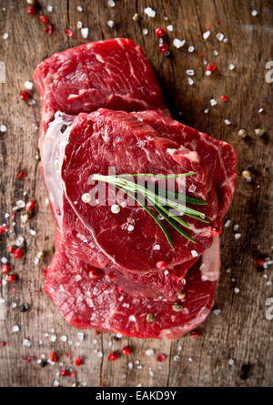 Fresh raw beef steak on wood Stock Photo