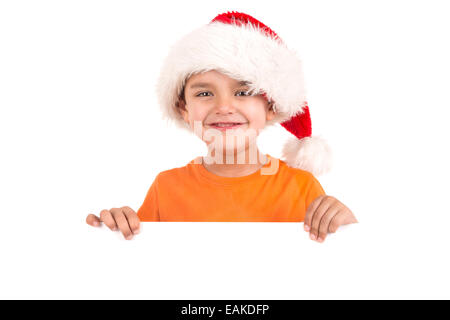 Happy young boy with Santa's hat posing with big board Stock Photo