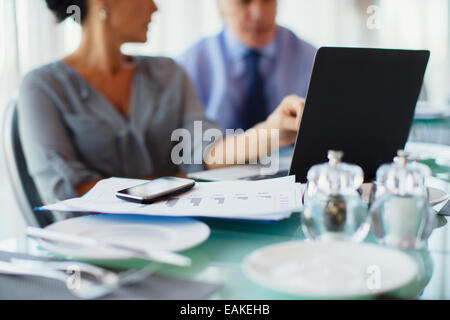 Business woman pointing to laptop screen Stock Photo