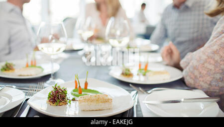 Fancy fish meal on plate in restaurant Stock Photo