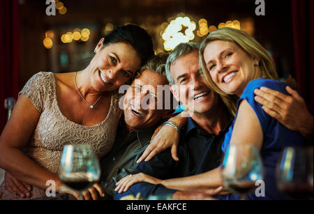 Portrait of smiling mature couples sitting together in restaurant Stock Photo