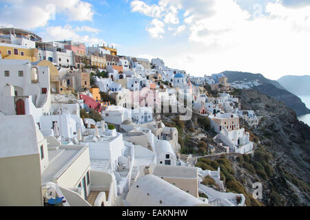 Oia town with traditional buildings painted white on the cliff side, Santorini, Cyclades, Greece. Stock Photo