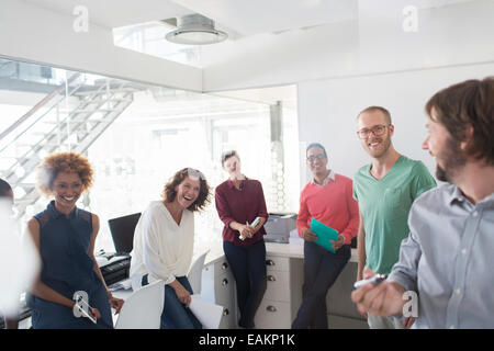 Smiling team having meeting in modern office Stock Photo