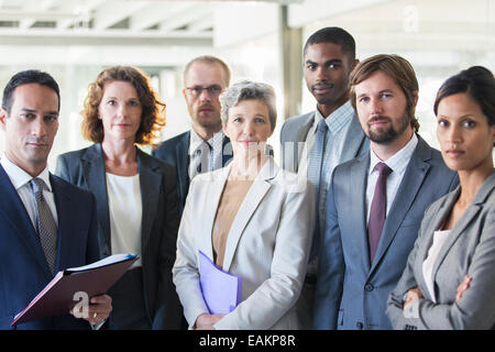 Group portrait of successful office team standing in office Stock Photo