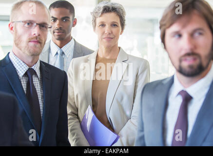 Group portrait of successful office team standing in office Stock Photo