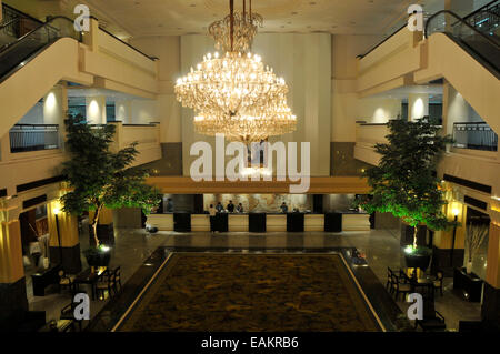 luxury hotel lobby with big roof lights and places to sit Stock Photo