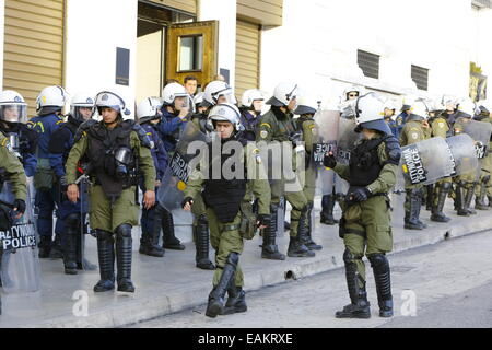 Angola Riot Police Riot police stand on a pavement as a group of people is searched nearby ...