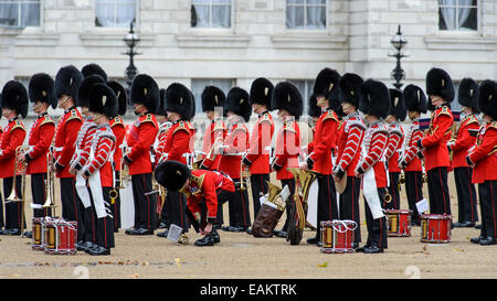 21/10/2014 at Horse Guards Parade, London: A guardsman of the Grenadier Guards ties his shoelaces Stock Photo