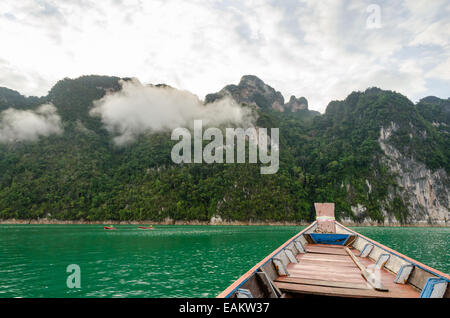 Travel by small boats in the morning at Ratchaprapha Dam, Khao Sok National Park, Surat Thani Province, Thailand Stock Photo