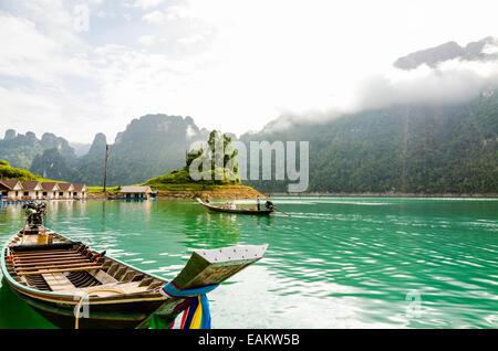 SURAT THANI, THAILAND - APR 27, 2013 : Tourist arrival by long tail boat in the morning at Ratchaprapha Dam at Khao Sok National Stock Photo