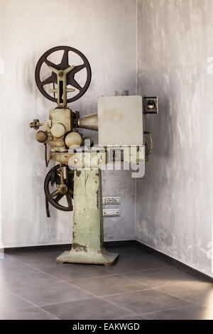 an old big cinema projector in the hallway of a theater Stock Photo