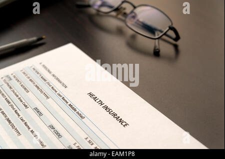 Filling health insurance application form Stock Photo