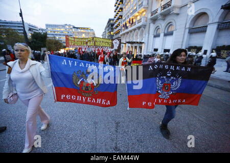 Protesters carry the flag of the Lugansk People's Republic (left) and the flag of the Donetsk People's Republic (right). Both are pro-Russian self-proclaimed states in the Ukraine. Thousands of Greeks marched to the US Embassy in Athen in remembrance of the Athens Polytechnic uprising of 1973. Greeks see the US as having responsibility for the Greek Military Junta of 1967–74. The protest was followed by a heavy police presence. © Michael Debets/Pacific Press/Alamy Live News Stock Photo