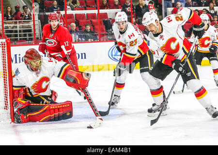 Raleigh, North Carolina, USA. 10th Nov, 2014. Calgary Flames goalie Jonas Hiller (1) and Calgary Flames left wing Brandon Bollig (25) and Calgary Flames center Sean Monahan (23) and Carolina Hurricanes center Eric Staal (12) during the NHL game between the Calgary Flames and the Carolina Hurricanes at the PNC Arena. The Carolina Hurricanes defeated the Calgary Flames 4-1. © Andy Martin Jr./ZUMA Wire/Alamy Live News Stock Photo